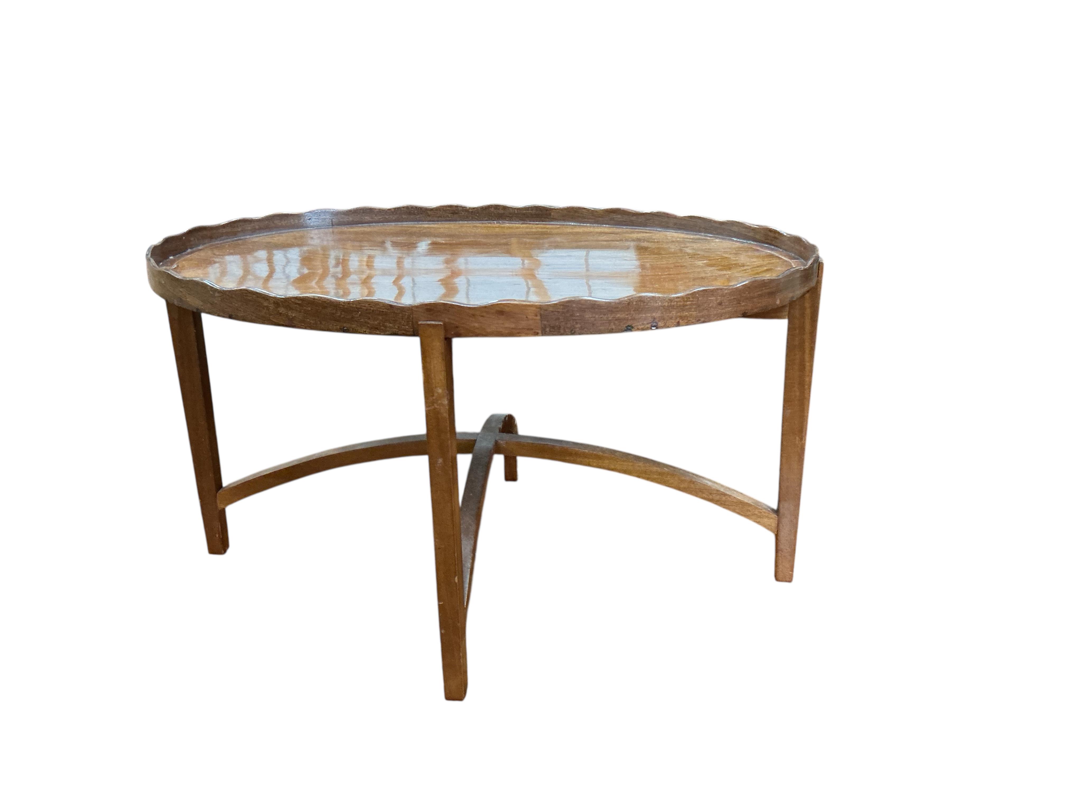 A George III oval mahogany tray on later 'X' framed stand, width 48cm, depth 39cm, height 33cm